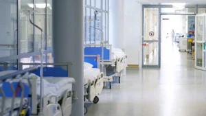 View of hospital beds lining a hallway