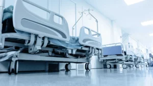 View of various hospital beds lining a hallway